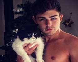 He is a cat lover and has adopted one black and white cat.